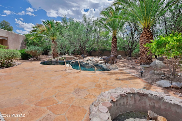 view of pool featuring a patio and pool water feature