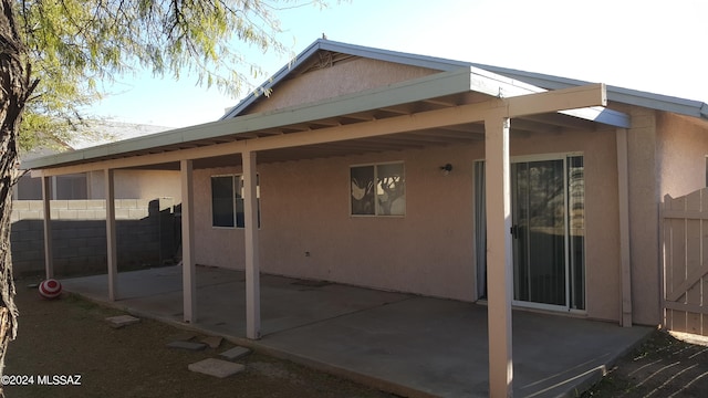 back of house with a patio