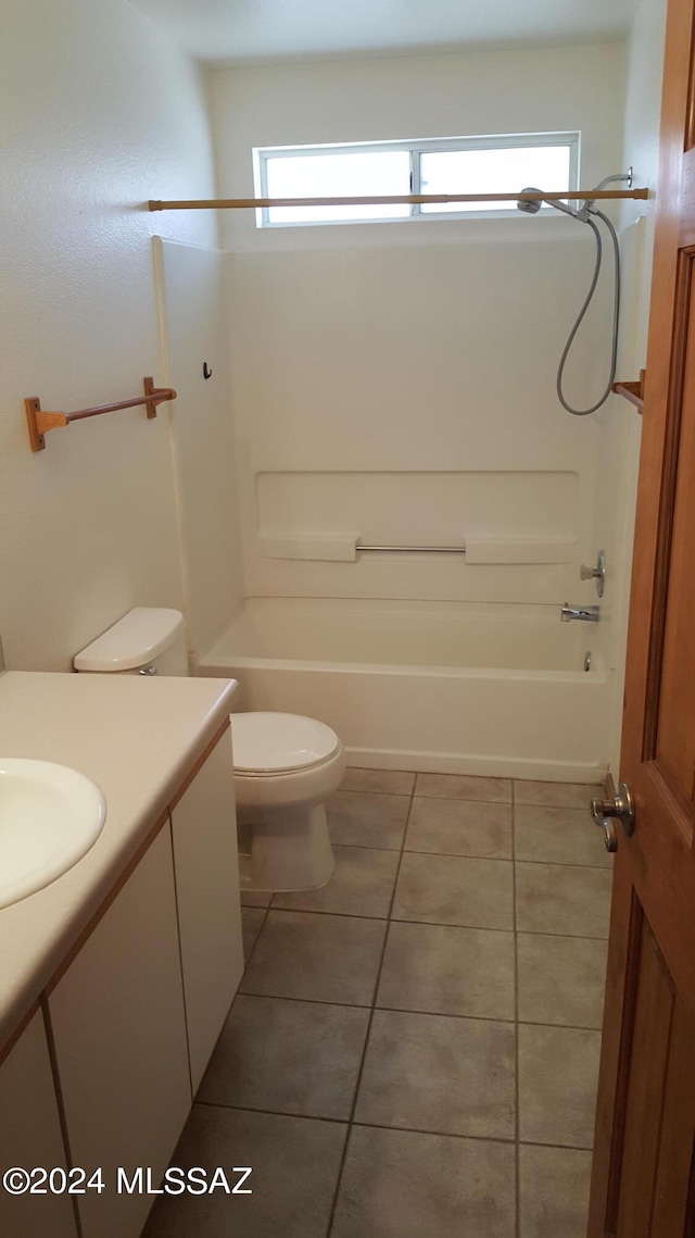 full bathroom featuring tile floors, shower / bath combination, toilet, and vanity