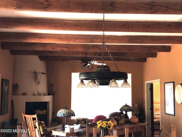 dining area with beam ceiling