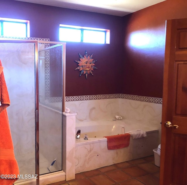 bathroom featuring tile patterned flooring, plenty of natural light, separate shower and tub, and toilet