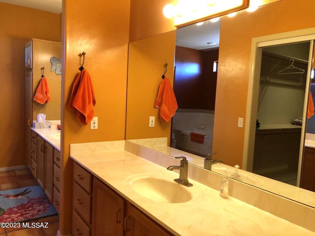 bathroom with tile patterned flooring and vanity