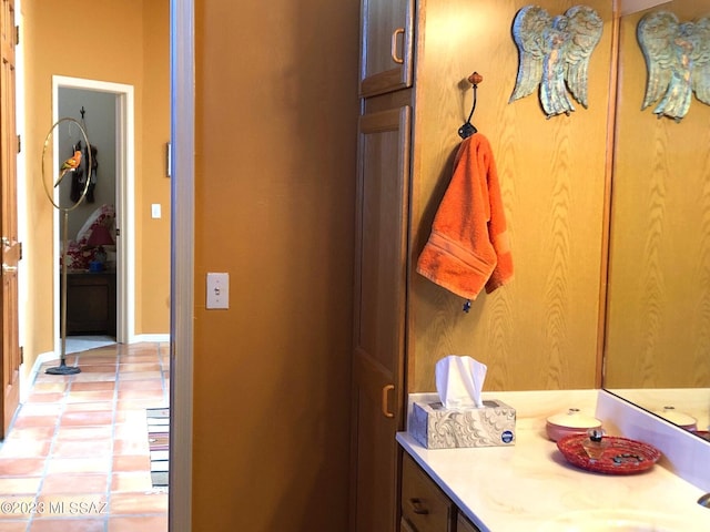 bathroom with tile patterned floors and vanity