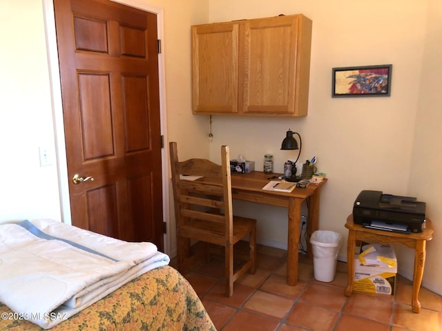 bedroom with light tile patterned floors