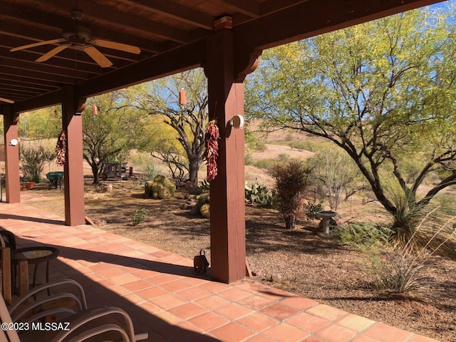 view of patio featuring ceiling fan