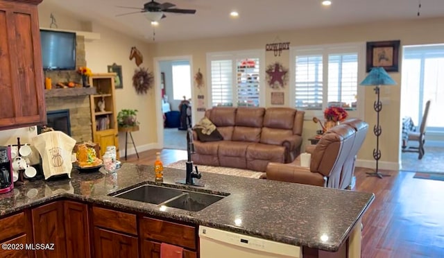 kitchen with hardwood / wood-style flooring, dishwasher, ceiling fan, and a wealth of natural light