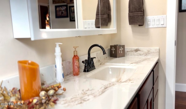 bathroom featuring vanity and hardwood / wood-style flooring