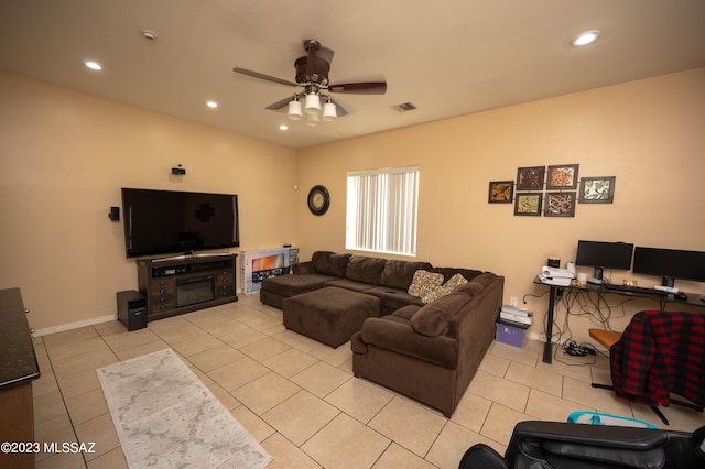 tiled living room featuring ceiling fan