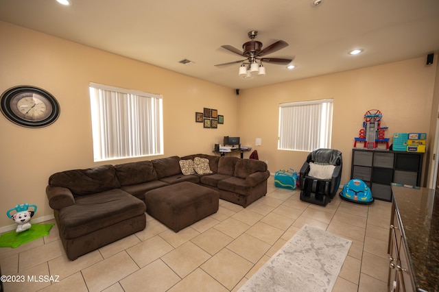 tiled living room with ceiling fan