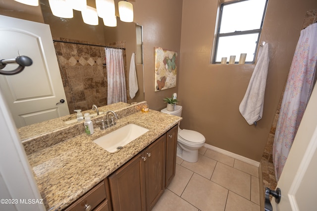 bathroom with vanity, tile patterned floors, and toilet