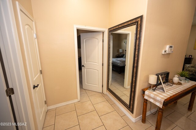 corridor featuring light tile patterned floors