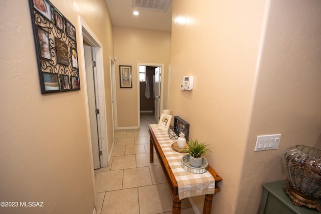 hallway featuring tile patterned flooring