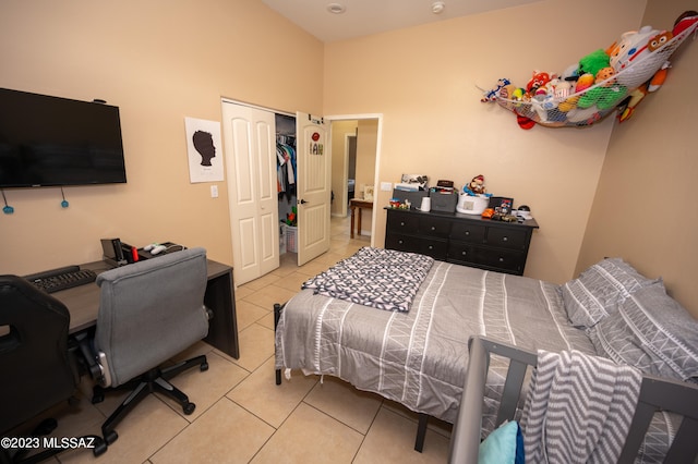 tiled bedroom featuring a closet