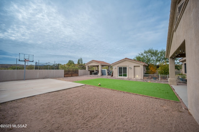 view of yard with a patio and an outdoor structure