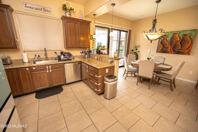 kitchen featuring kitchen peninsula, stainless steel dishwasher, light stone countertops, pendant lighting, and sink