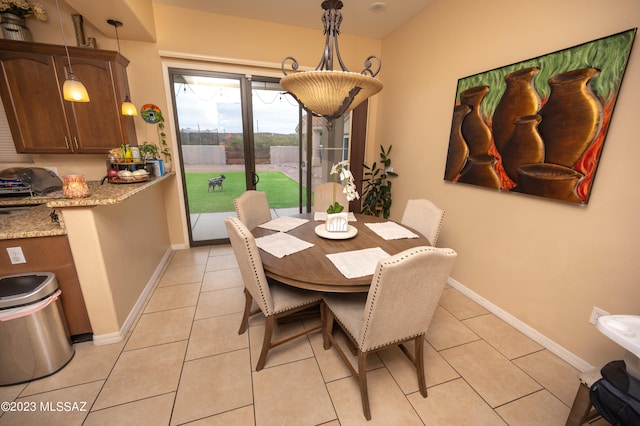 dining area with light tile patterned floors