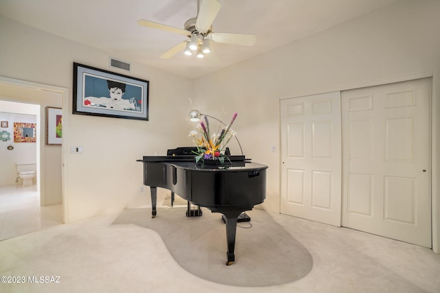 misc room with ceiling fan and light colored carpet