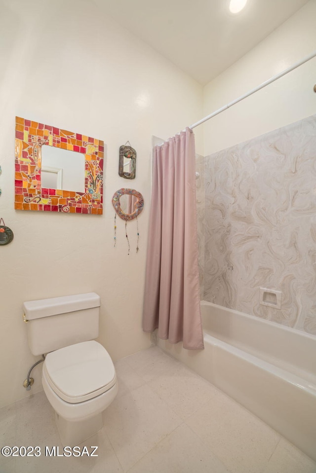 bathroom with toilet and shower / bath combo with shower curtain