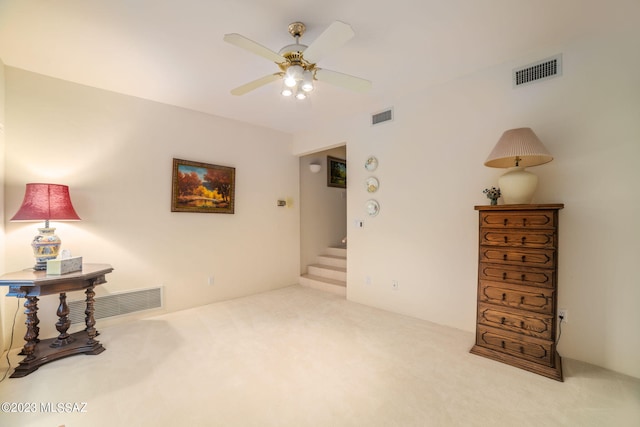 interior space with ceiling fan