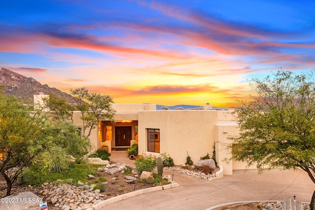 pueblo-style home with a mountain view