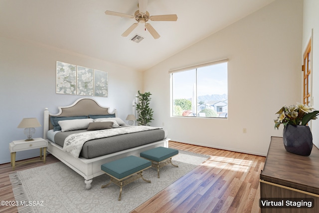 bedroom with wood-type flooring, lofted ceiling, and ceiling fan