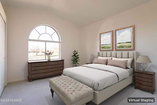 bedroom featuring vaulted ceiling and carpet floors