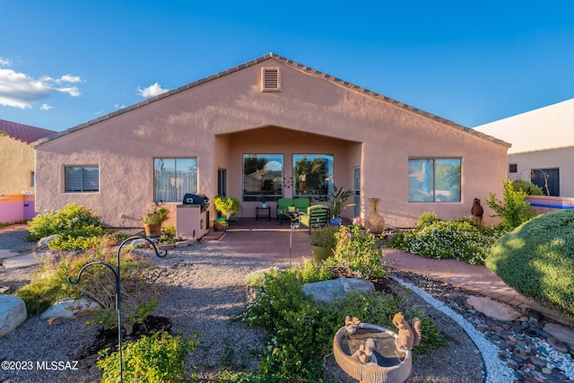 view of front of home with a patio area