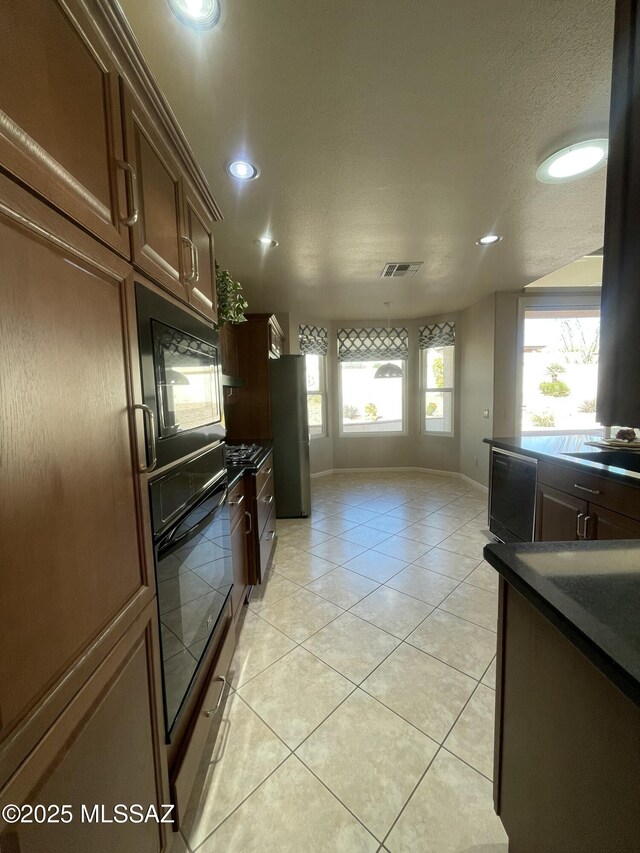 hallway with light tile patterned floors