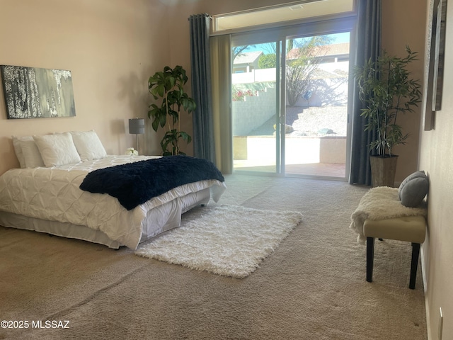 bedroom featuring carpet floors and access to outside