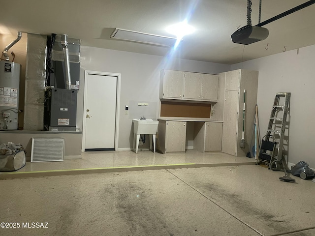 garage with water heater, a garage door opener, heating unit, and sink