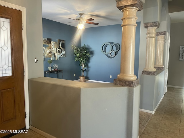 reception with ceiling fan and decorative columns