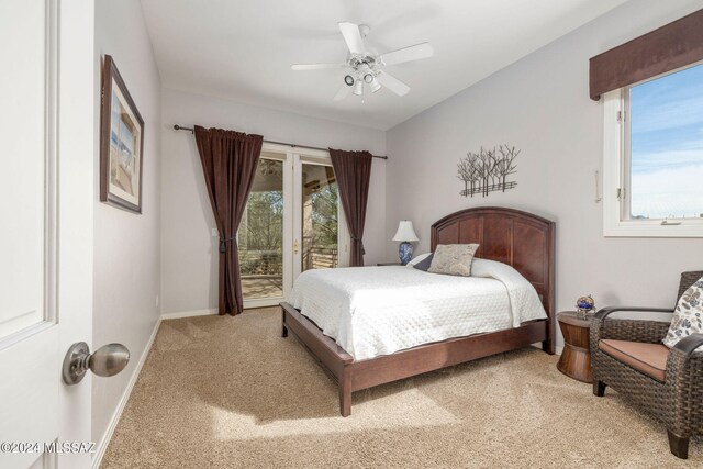 carpeted bedroom with access to outside, multiple windows, and ceiling fan