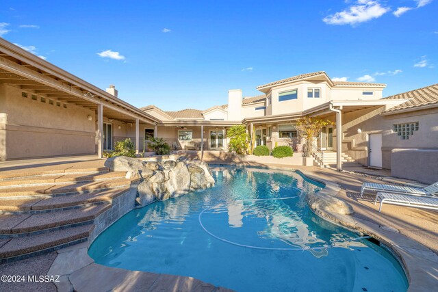 view of swimming pool with a patio area