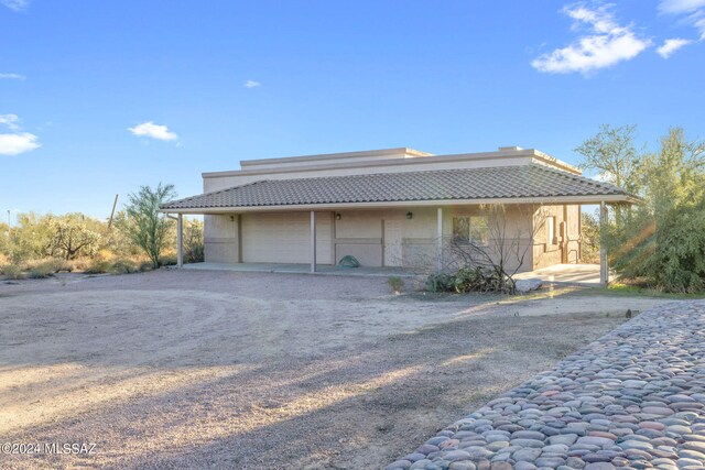 view of property exterior with a carport