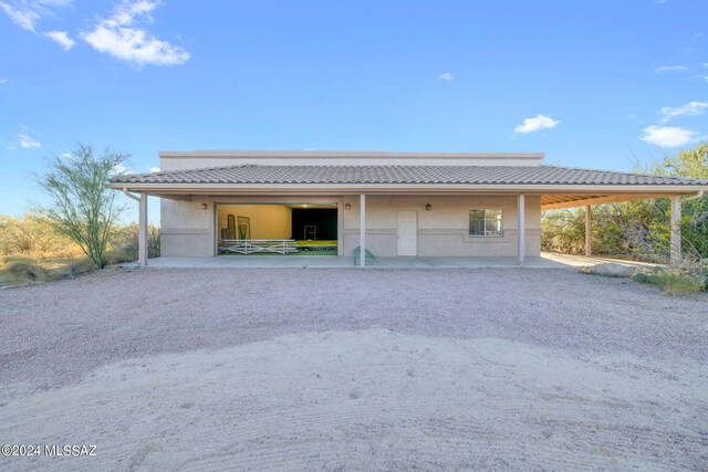 exterior space with a carport