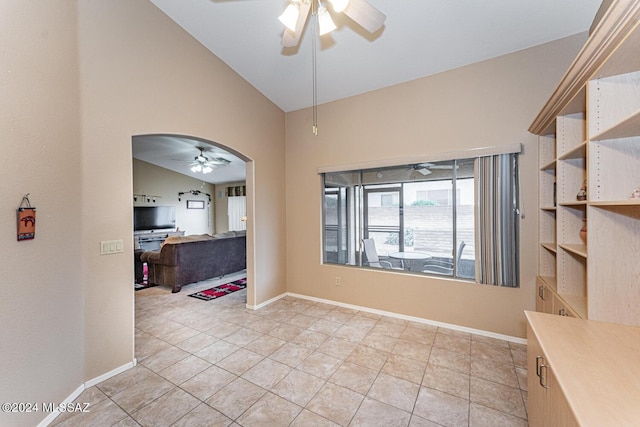 interior space featuring ceiling fan and lofted ceiling