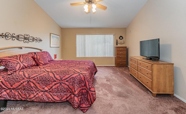 carpeted bedroom with ceiling fan and vaulted ceiling