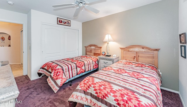 carpeted bedroom featuring ceiling fan and a closet