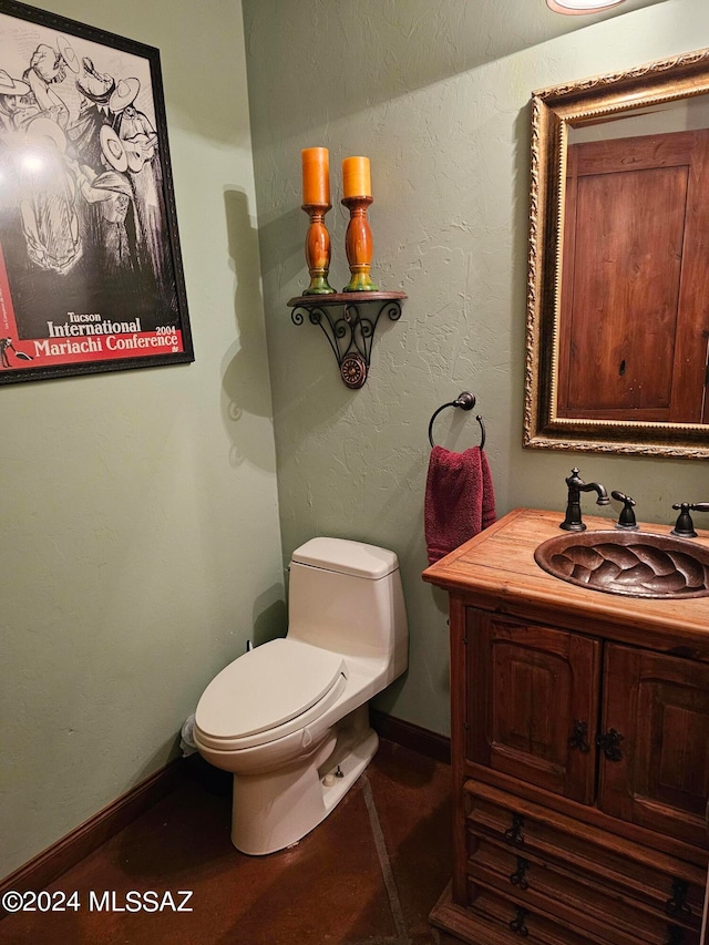 bathroom with toilet and vanity