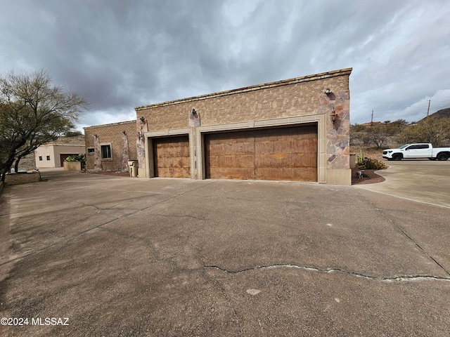 view of side of home with a garage