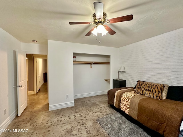464 N 1st Ave, Thatcher, AZ 85552 - bedroom with ceiling fan, a textured ceiling, brick wall, and a closet