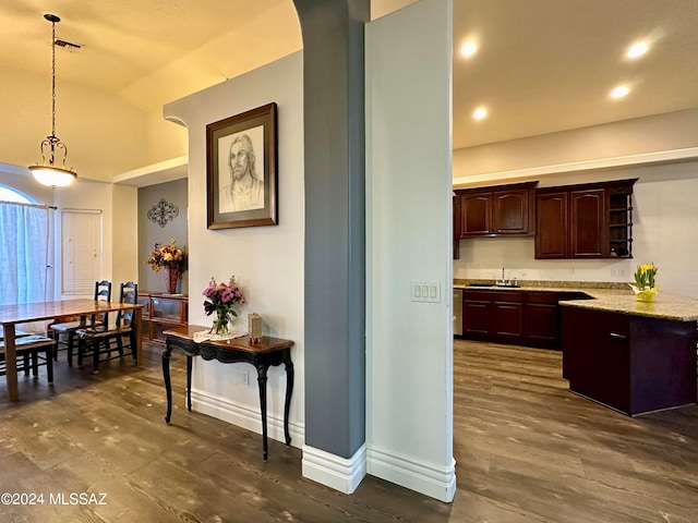 464 N 1st Ave, Thatcher, AZ 85552 - kitchen with dark brown cabinetry, sink, dark hardwood / wood-style floors, pendant lighting, and vaulted ceiling