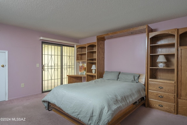 carpeted bedroom with a textured ceiling