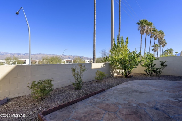 view of patio / terrace with a mountain view