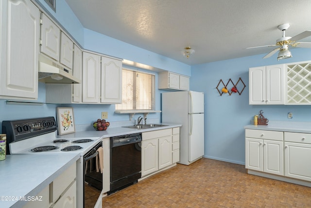 kitchen featuring white appliances, white cabinets, and a textured ceiling