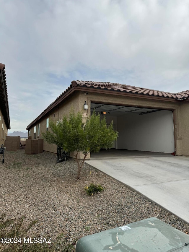 view of side of home with a garage