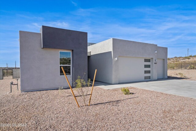 contemporary house featuring a mountain view and a garage