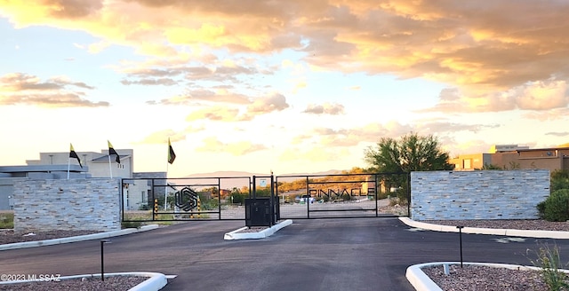 view of gate at dusk