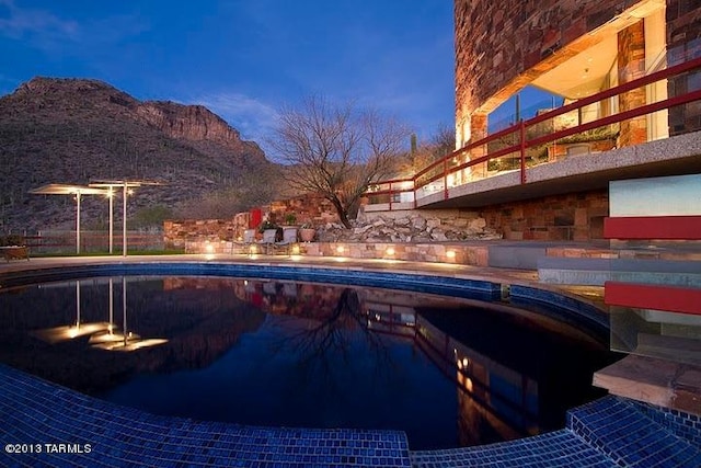 view of swimming pool featuring a mountain view