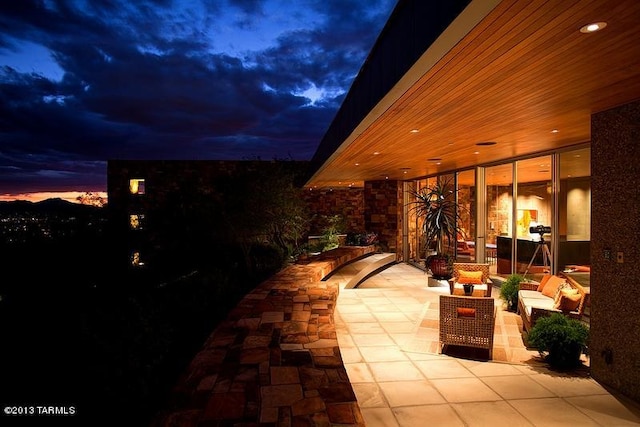 view of patio terrace at dusk